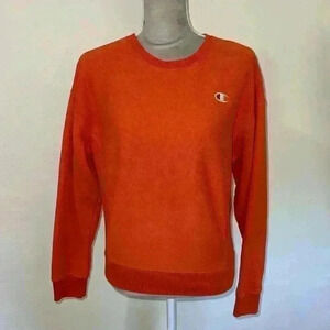 Champion orange women’s crew neck sweatshirt, size Small.
